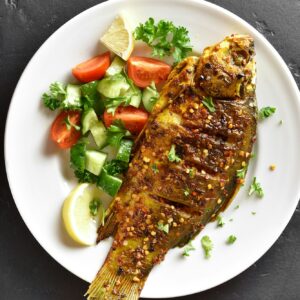 Roasted fish on plate