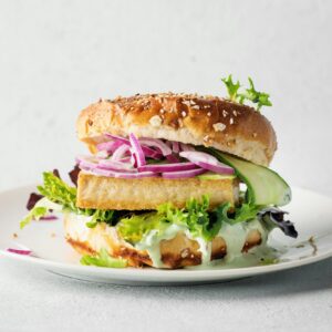 Tofu burger with vegetables on plate